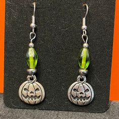 Hand Crafted Halloween Earrings With Spooky Jack O Lantern Charms And Green Glass Beads. French Wire, 2" Drop. Brand New! Halloween Hypoallergenic Metal Jewelry, Adjustable Nickel-free Earrings For Halloween, Halloween Sterling Silver Dangle Earrings, Nickel-free Silver Earrings For Halloween, Silver Ear Wire Earrings For Halloween, Green Halloween Party Earrings, Hypoallergenic Jewelry For Halloween Party, Green Halloween Party Jewelry, Green Novelty Earrings For Halloween