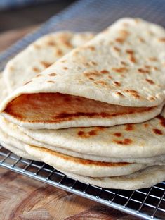 some tortillas are sitting on a cooling rack