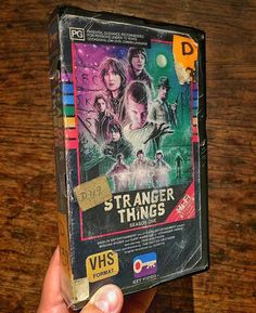 someone is holding up a dvd case for the movie strange things