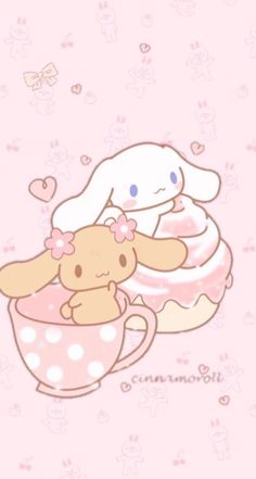 a cute little bunny sitting in a cup with a teddy bear