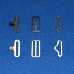 four metal clips are shown on a blue background