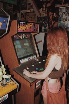 a woman playing a video game in a room