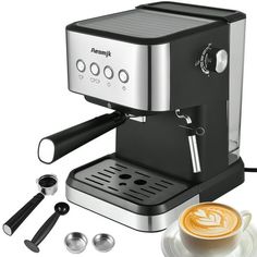 an espresso machine sitting next to a cup of coffee