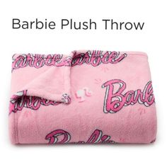 a pink blanket with the word barbie on it and an image of barbie's name