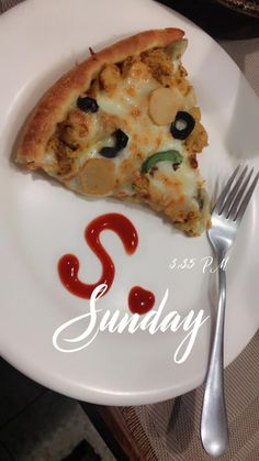 a slice of pizza sitting on top of a white plate next to a fork and knife