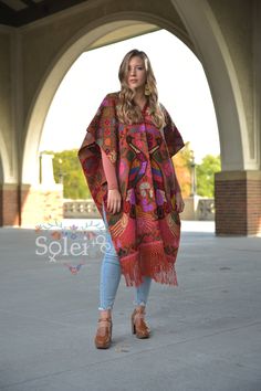 "This beautiful full body Mexican poncho is handmade by Cross Stitch both in the front and in the back. The colorful floral design will add style to your wardrobe and keep you warm too! One size fits all: From extra small to 2x It measures 47\" Long and 31.5\" wide" Red Folk Style Poncho For Fall, Traditional Red Poncho For Fall, Traditional Red Fall Poncho, Traditional Multicolor Cape For Fall, Traditional Multicolor Poncho For Fall, Folk Style Poncho For Fall, Traditional Multicolor Fall Poncho, Red Poncho For Festival In Fall, Red Cape Poncho For Festival