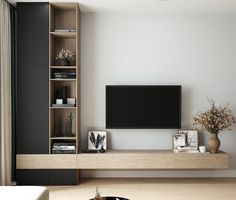 a living room with a large flat screen tv on the wall