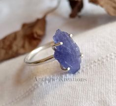 Raw Blue Tanzanite Ring, 925 Sterling Silver Ring, Raw Tanzanite Ring, Boho Statement Ring, Bohemian Ring, Gift For Him OR Her, Unisex Ring ----------Description--------- Metal  : 925 Sterling silver Style : Statement Ring Gemstone : Raw Blue Tanzanite Color :  Blue Note: Due to the natural formation of this Raw gemstone. Slight variation in design and color are to be expected.. Physically, Tanzanite alleviates skin disorders, clears the throat and lungs, and can be used to treat disorders of the ears and eyes. It boosts the immune system, speeding up recovery after an illness, and detoxifies and regenerates cells and tissues. Returns- We understand that it is very important to be satisfied with the Purchase you make. So for returns and exchange we request you to contact us within 3 days o Handmade Tanzanite Jewelry For Anniversary, Handmade Tanzanite Jewelry Gift, Large Tanzanite Ring, Handmade Adjustable Sapphire Ring In Sterling Silver, Timeless Silver Tanzanite Rings, Luxury Blue Tanzanite Ring, Raw Tanzanite, Cells And Tissues, Blue Tanzanite