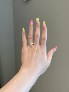 a woman's hand with white manicures and a ring on her finger