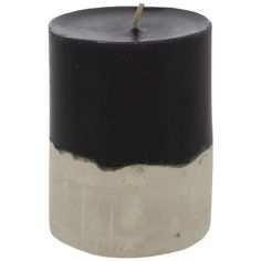 a black and white candle with a wooden stick sticking out of it's top