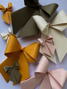 several different types of paper bows on a table