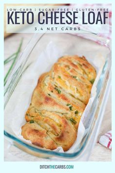 a glass dish filled with cheesy bread on top of a table