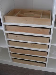 the shelves are filled with different types of drawers