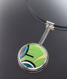 MODERN SILVER CLOISONNE ENAMEL PENDANT – www.janvandiver.com Green Enamel Jewelry With Black Enamel, Green Cabochon Enamel Jewelry, Modern Green Pendant Jewelry, Modern Green Round Pendant Jewelry, Hand Painted Green Modern Jewelry, Green Pendant Necklace With Inlay, Modern Hand Painted Green Jewelry, Modern Green Enamel Jewelry, Contemporary Green Sterling Silver Jewelry