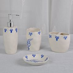 a bathroom set with blue flowers on it