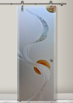 a glass door with an abstract design on it