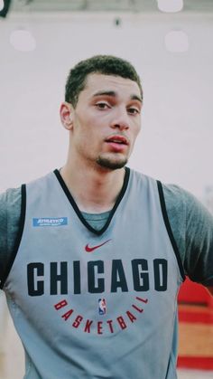 a young man in a chicago basketball jersey