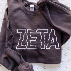 This trendy, unique, handcrafted Wavy Gildan embroidered crewneck sweatshirt is sure to stand out on any campus! Grab one for you, your big/little, or a group of sisters (bulk discount information can be found below). If you need some greek letter sweatshirt inspiration, please visit the inspiration page! Picture Details Pictures: ⭑ #1: Brown sweatshirt, White thread, Indigo sweatshirt, Light Blue thread, Heliconia sweatshirt, MATCH thread option ⭑ #2: Heliconia sweatshirt, MATCH thread option ⭑ Fall Campus Tops With Embroidered Graphics, Campus Sweatshirt With Embroidered Graphics, Long Sleeve Sweatshirt With School Spirit Embroidery, Trendy Tops With Custom Embroidery For Fall, Long Sleeve Tops With Letter Embroidery For Campus, Collegiate Embroidered Text Sweatshirt For Fall, Collegiate Style Embroidered Sweatshirt For Fall, Collegiate Style Fall Sweatshirt With Embroidered Text, Casual College Sweatshirt With Custom Embroidery