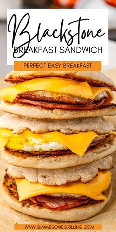 a stack of breakfast sandwiches with cheese on top and bacon on the side, in front of