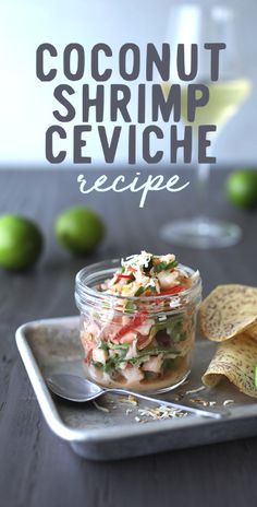 a glass bowl filled with food next to chips and limes on a tray that says coconut shrimp ceviche recipe