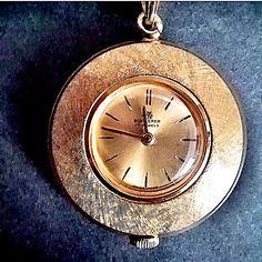 Vintage Bucherer Gold Plated Ladies Pendant Stem Wind Watch. Round Face With Gold Tone Florentine Finish. This Watch Is In Perfect Working Condition And Keeps Perfect Time. 30" Chain Pendant Watch, Pendant Watches, Round Face, Accessories Watches, Gold Tones, Gold Plate, Women Accessories, Plating, Chain