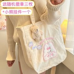 SPECIFICATIONSbags for women: Cartoon Shoulder BagTypes of bags: Shoulder & HandbagsStyle: FashionShape: Casual ToteSeason: spring/autumn/summer/winterPlace Of Origin: ZHE JIANG ProvincePlace Of Origin: ZHE JIANG ProvincePattern Type: CartoonOrigin: CN(Origin)Occasion: VersatileNumber of Handles/Straps: SingleModel Number: MO481Main Material: CanvasLining Material: CanvasKawaii bag: Casual Book Storage SchoolbagInterior: Interior Slot PocketHardness: HARDHandbags Type: Shoulder BagsGender: WOMEN Cute Beige Canvas Bag For Daily Use, Cute Canvas School Bag, Cute Beige Shoulder Bag For School, Cute Beige School Shoulder Bag, Cute Pink Bunny Design Bags, Cute Everyday Bags With Bunny Design, Cute Bunny Design Bags For Everyday Use, Cute Bunny Design Bag For Everyday Use, Cute White Bag With Bunny Design