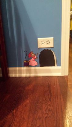 the door is open to show a cartoon cat and dog in front of a toaster oven