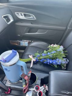 flowers and other items are placed in the back seat of a car