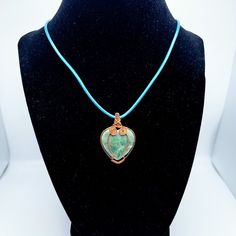 This "Peace" necklace is filled with crystal power - 💖💎 It's the perfect pick for when you need a reminder of serenity and success. 🤩Make it yours and enjoy a daily dose of tranquility. Spiritual Turquoise Necklace With Round Pendant, Spiritual Heart Pendant Necklace With Natural Stones, Turquoise Wire Wrapped Crystal Necklace For Healing, Turquoise Pendant Crystal Necklace Gift, Handmade Heart-shaped Jewelry For Meditation, Spiritual Healing Crystal Necklace With Heart Pendant, Spiritual Healing Heart Pendant Necklace, Spiritual Heart Pendant Crystal Necklace For Healing, Spiritual Healing Crystal Heart Necklace