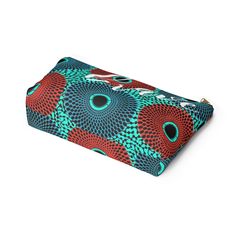 These t-bottom pouches now come in our retro color burst Ankara pattern print, and are great for pretty much anything. They make an fabulous, stylish grab and go bag; pencil case and cosmetic travel bag. Constructed of a durable material with a zipper closure. .: 100% Polyester .: Multiple sizes .: T-bottom 2.5 inches long .: With non-laminated lining Large Width, in 2.88 Length, in 12.29 Height, in 6.93 Trendy Multicolor Cosmetic Bag, Trendy Multicolor Pencil Case With Zipper, Trendy Multicolor Pouch For Personal Use, Multicolor Rectangular Pencil Case For Travel, Multicolor Rectangular Travel Pencil Case, Multicolor Zipper Pouch Pencil Case For Travel, Travel Multicolor Zipper Pouch Pencil Case, Trendy Multicolor Portable Cosmetic Bag, Trendy Multicolor Cosmetic Bag With Removable Pouch