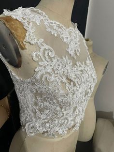 White Sleeveless Wedding Dress For Ceremony, Elegant Sleeveless Lace Bodice, Elegant White Sleeveless Bodice, White Sleeveless Lace Bodice, Sleeveless Sheer Bodice For Wedding, Sleeveless Lace Bridesmaid Wedding Dress, Wedding Ball Gown With Sheer Bodice, Fitted Sleeveless Wedding Dress For Ceremony, White Sleeveless Wedding Dress For Wedding Night