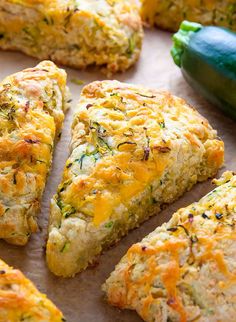 several pieces of quiche sitting on top of a baking sheet