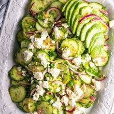 cucumber and feta salad on a white platter