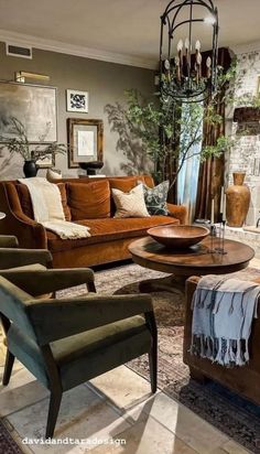 a living room filled with furniture and a chandelier