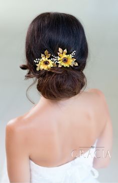 a woman wearing a bridal hair comb with sunflowers on it