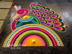 colorful peacock design on the ground for diwaling