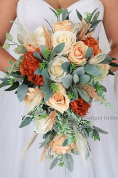 a bridal bouquet with orange and white flowers