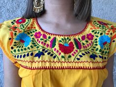 "Beautiful embroidered dress, ideal for spring and summer, mexican parties, etc. Bright and colourful. Sleeveless Loose fit Includes the fabric sash. Fits size Small-Medium Measurements taken flat: Armpit to armpit 19\" Width 22\" Length 60\"" Yellow Bohemian Maxi Dress With Floral Embroidery, Yellow Maxi Dress With Floral Embroidery, Yellow Embroidered Maxi Dress For Beach, Yellow Embroidered Maxi Dress For The Beach, Traditional Floral Embroidery Maxi Dress For Fiesta, Traditional Floral Embroidered Maxi Dress For Fiesta, Traditional Embroidered Dress For Cinco De Mayo Beach Event, Fiesta Floral Embroidered Maxi Dress, Fiesta Maxi Embroidered Dress With Floral Details