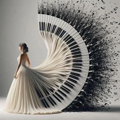 a woman in a white dress is standing next to an artistic piece of art that looks like piano keys