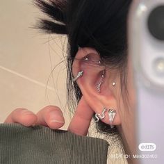 a person with ear piercings on their ears