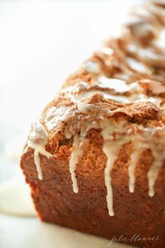 a loaf of cinnamon bread with icing drizzled on top