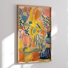 a painting hanging on the wall next to a vase