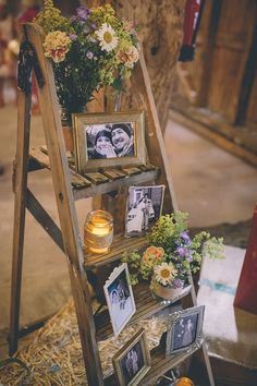 an old ladder has pictures and flowers on it