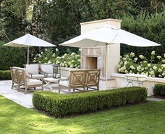 an outdoor dining area with chairs and umbrellas