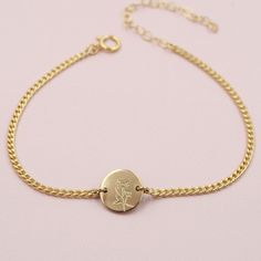 Our Birthflower Disc Bracelet features a tiny engraved disc with the birthflower of your choice hanging along a sturdy curb chain. Finished with a spring ring clasp and extender, making it easy to wear and adjust for the perfect fit.DETAILS- 14kt gold filled or sterling silver- 6" long with a 2" extender- Can be worn 6-8 inches- Choose one birthflower for engraving January: CarnationFebruary: VioletMarch: Cherry BlossomApril: DaisyMay: LilyJune: RoseJuly: LotusAugust: PoppySeptember: AsterOctobe Personalized Gold Jewelry, Disc Bracelet, Pearl Necklace Earrings, Chunky Rings, Fit Details, Birthstone Bracelets, Personalized Bracelets, Anklet Jewelry, Birth Flowers