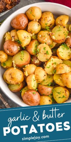 garlic and butter potatoes in a white bowl with the title overlay reads garlic and butter potatoes