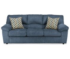 a blue couch with two pillows on it