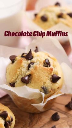 chocolate chip muffins sitting on top of a wooden cutting board