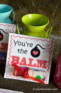 there is a sign that says you're the balm next to two cups