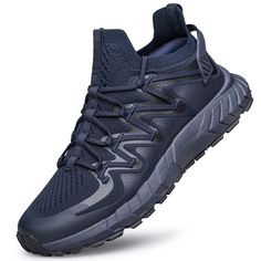 men's athletic shoes in navy blue and grey color scheme with laces on the upper part of the shoe